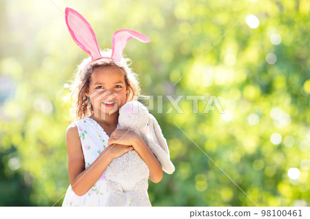 Little girl with Easter bunny. Egg hunt. Little girl with Easter bunny. Egg hunt. 98100461
