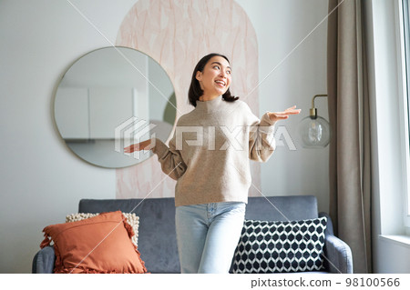 People and emotions. Joyful teen girl dancing in her room, feeling happy and carefree, concept of joy and satisfaction People and emotions. Joyful teen girl dancing in her room, feeling happy and carefree, concept of joy and satisfaction 98100566