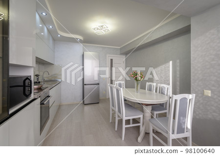 Interior of modern trendy white kitchen Interior of modern trendy white kitchen 98100640