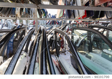 Disassembled cars on a car dump are on sale for spare parts. Disassembled cars on a car dump are on sale for spare parts. 98101700