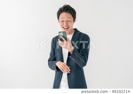 Businessman surprised smartphone middle man 98102214