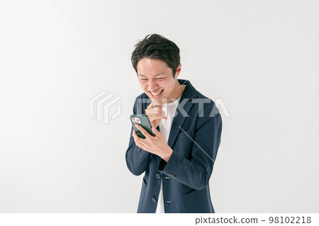 Businessman surprised smartphone middle man 98102218