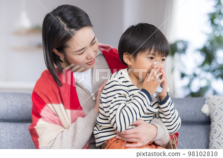 Boy inhaling asthma with a nebulizer 98102810