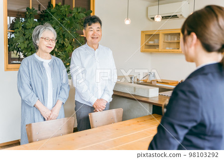 Asian elderly couple greeting with counseling / consultation and business woman in suit Asian elderly couple greeting with counseling / consultation and business woman in suit 98103292