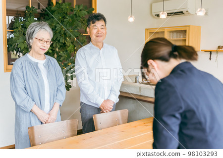 Asian elderly couple greeting with counseling / consultation and business woman in suit Asian elderly couple greeting with counseling / consultation and business woman in suit 98103293