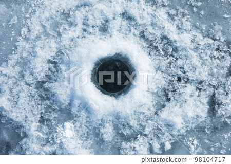 Smelt fishing image: A hole in the ice of a lake 98104717