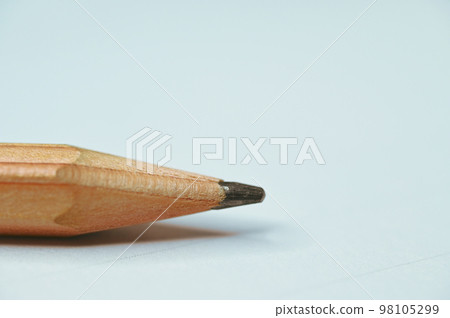 wooden pencil on white paper 98105299