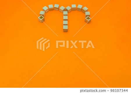 Orange background with one wood cube divided into left and right and branching left and right 98107344