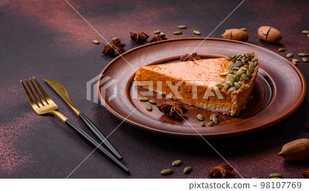 Beautiful tasty pumpkin pie with seeds 98107769