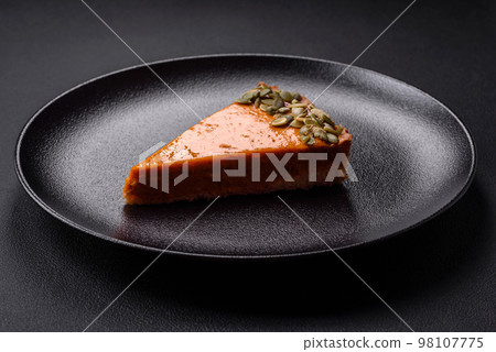 Beautiful tasty pumpkin pie with seeds Beautiful tasty pumpkin pie with seeds 98107775