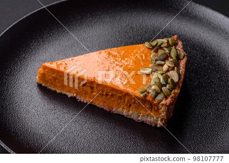 Beautiful tasty pumpkin pie with seeds Beautiful tasty pumpkin pie with seeds 98107777