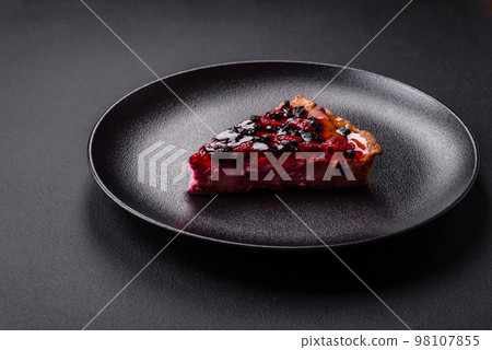 Delicious fresh pie with raspberries and other berries 98107855