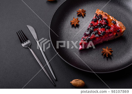 Delicious fresh pie with raspberries and other berries Delicious fresh pie with raspberries and other berries 98107869