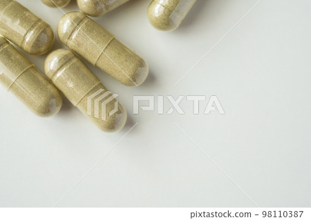 Herbal medicine capsules on white background Herbal medicine capsules on white background 98110387