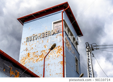 Damaged facade of old building of train station in city Ruzomberok at Slovakia Damaged facade of old building of train station in city Ruzomberok at Slovakia 98110714