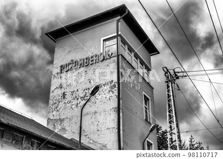Damaged facade of old building of train station in city Ruzomberok at Slovakia Damaged facade of old building of train station in city Ruzomberok at Slovakia 98110717
