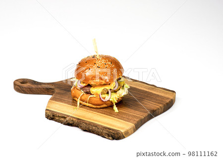 Fresh homemade hamburger on wooden serving board . White background with copy space 98111162