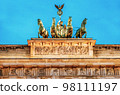 Statue on Brandenburg gate in city Berlin at Germany Statue on Brandenburg gate in city Berlin at Germany 98111197