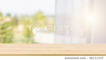 Empty wood table top with window curtain abstract blur background for product display 98112147