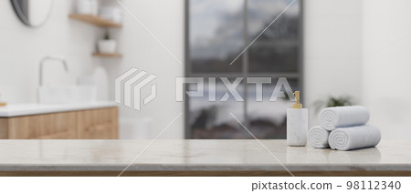 Mockup space on white marble tabletop over blurred background of luxury white bathroom Mockup space on white marble tabletop over blurred background of luxury white bathroom 98112340