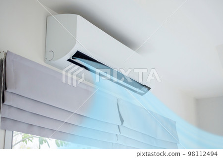Air conditioner on white wall room interior background Air conditioner on white wall room interior background 98112494