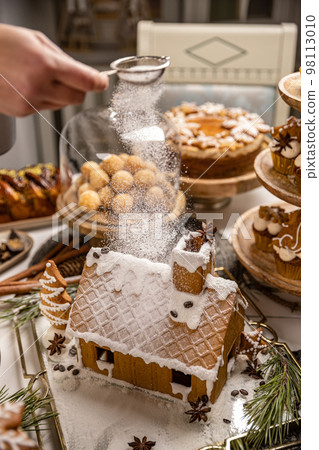Festive Christmas table with sweets Festive Christmas table with sweets 98113010