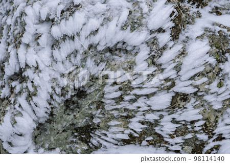Ice frost on stone texture. Winter abstract background 98114140