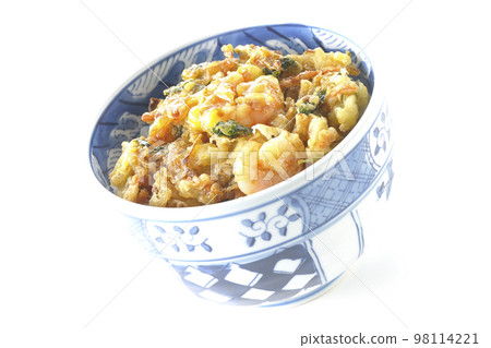 Kakiage rice bowl with vegetables and shrimp shot against a white background Kakiage rice bowl with vegetables and shrimp shot against a white background 98114221