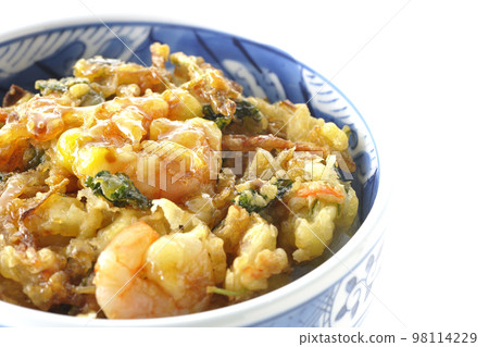 Kakiage rice bowl with vegetables and shrimp shot against a white background Kakiage rice bowl with vegetables and shrimp shot against a white background 98114229