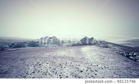 Dramatic winter dark desert steppe on a highland mountain plateau Dramatic winter dark desert steppe on a highland mountain plateau 98115746