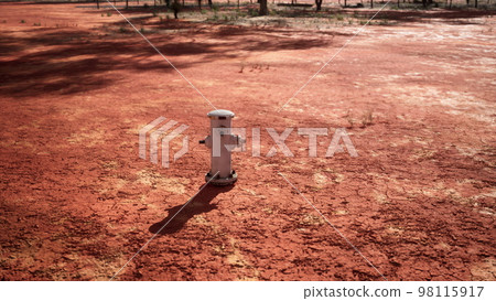 old rusted fire hydrant in desert 98115917
