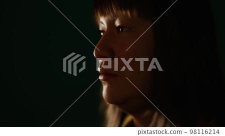 adult Mexican lady portrait in the dark 98116214