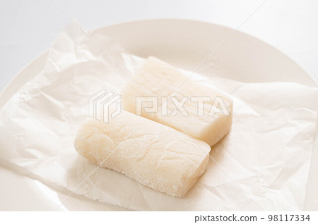 Mochi with a pestle on a plate Mochi with a pestle on a plate 98117334
