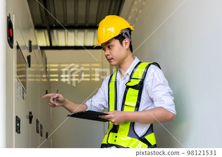 Electrical engineer working in control room. 98121531