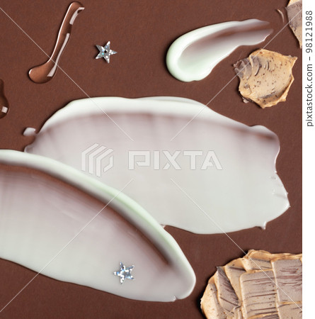 Different swatches of cosmetic products for the face and body. Texture of skin care cosmetic product. Different swatches of cosmetic products for the face and body. Texture of skin care cosmetic product. 98121988