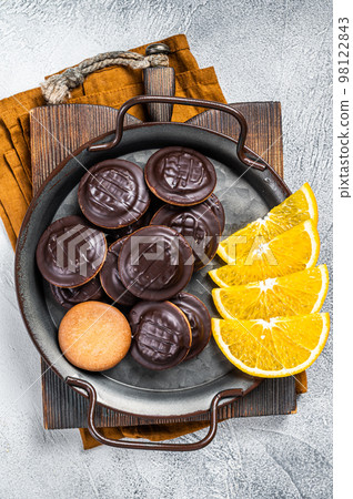 Orange Flavored Round Jaffa Cakes with Chocolate. White background. Top view 98122843