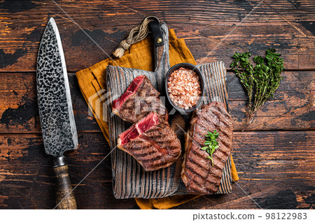 Oyster Top Blade beef meat steak grilled on summer BBQ. Wooden background. Top View 98122983