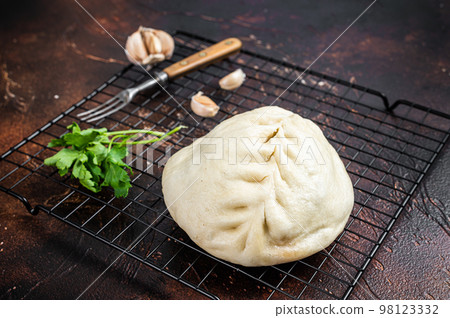 Pyan-se, Pyanse - Traditional Korean steamed pie bun with vegetable and meat. Dark background. Top view 98123332