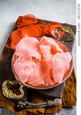 Cooking kerupuk or prawn shrimp crackers, chips. White background. Top view Cooking kerupuk or prawn shrimp crackers, chips. White background. Top view 98123430