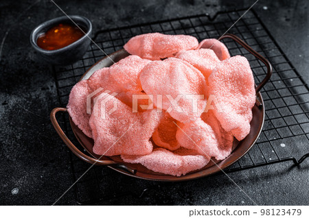 Vietnamese prawn shrimp crackers, chips, kerupuk. Asian fastfood. Black background. Top view 98123479