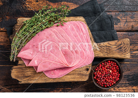 Sliced Beef Ham snack on wooden board. Wooden background. Top view Sliced Beef Ham snack on wooden board. Wooden background. Top view 98123536