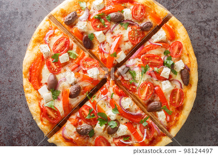 Hot fresh Greek pizza with olives, bell peppers, feta cheese and tomatoes closeup on wooden board. Horizontal top view Hot fresh Greek pizza with olives, bell peppers, feta cheese and tomatoes closeup on wooden board. Horizontal top view 98124497