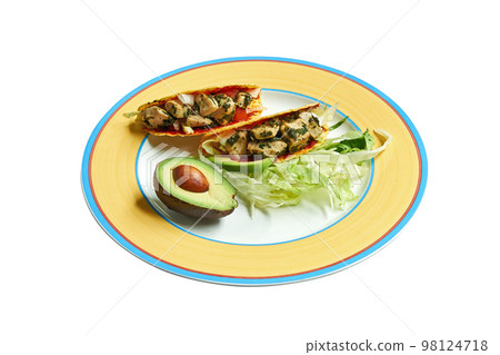 Tacos on plate with salad and avocado 98124718