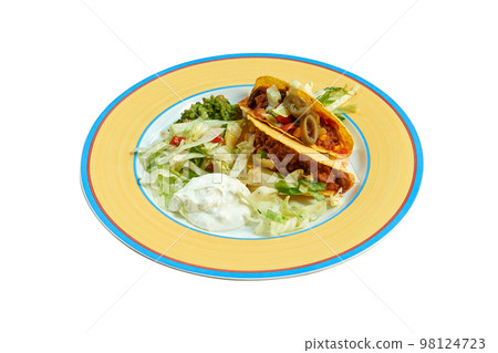 Tacos on plate with salad and avocado Tacos on plate with salad and avocado 98124723