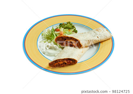 Burritos on plate with salad and avocado Burritos on plate with salad and avocado 98124725