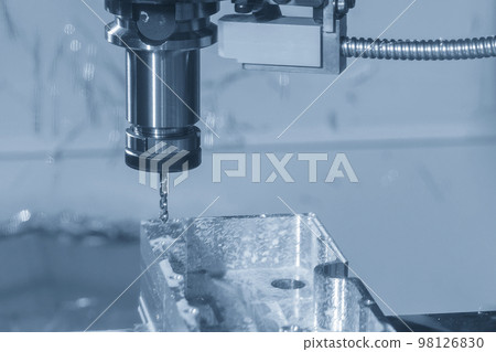 The CNC milling machine tapping process at aluminum part. 98126830