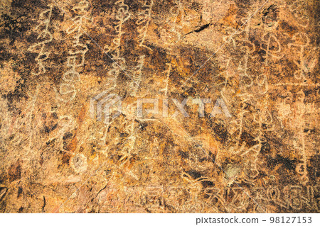 Ancient inscriptions on a stone in the Tamgaly tas tract on the Ili River in the Almaty region Ancient inscriptions on a stone in the Tamgaly tas tract on the Ili River in the Almaty region 98127153