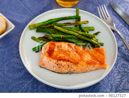Fresh salmon steak with bunch of roasted asparagus Fresh salmon steak with bunch of roasted asparagus 98127527