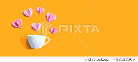 Coffee cup with paper craft hearts 98128309