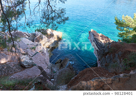 Top view of beautiful blue sea surface and fantastic rocky coast, Montenegro Top view of beautiful blue sea surface and fantastic rocky coast, Montenegro 98128401